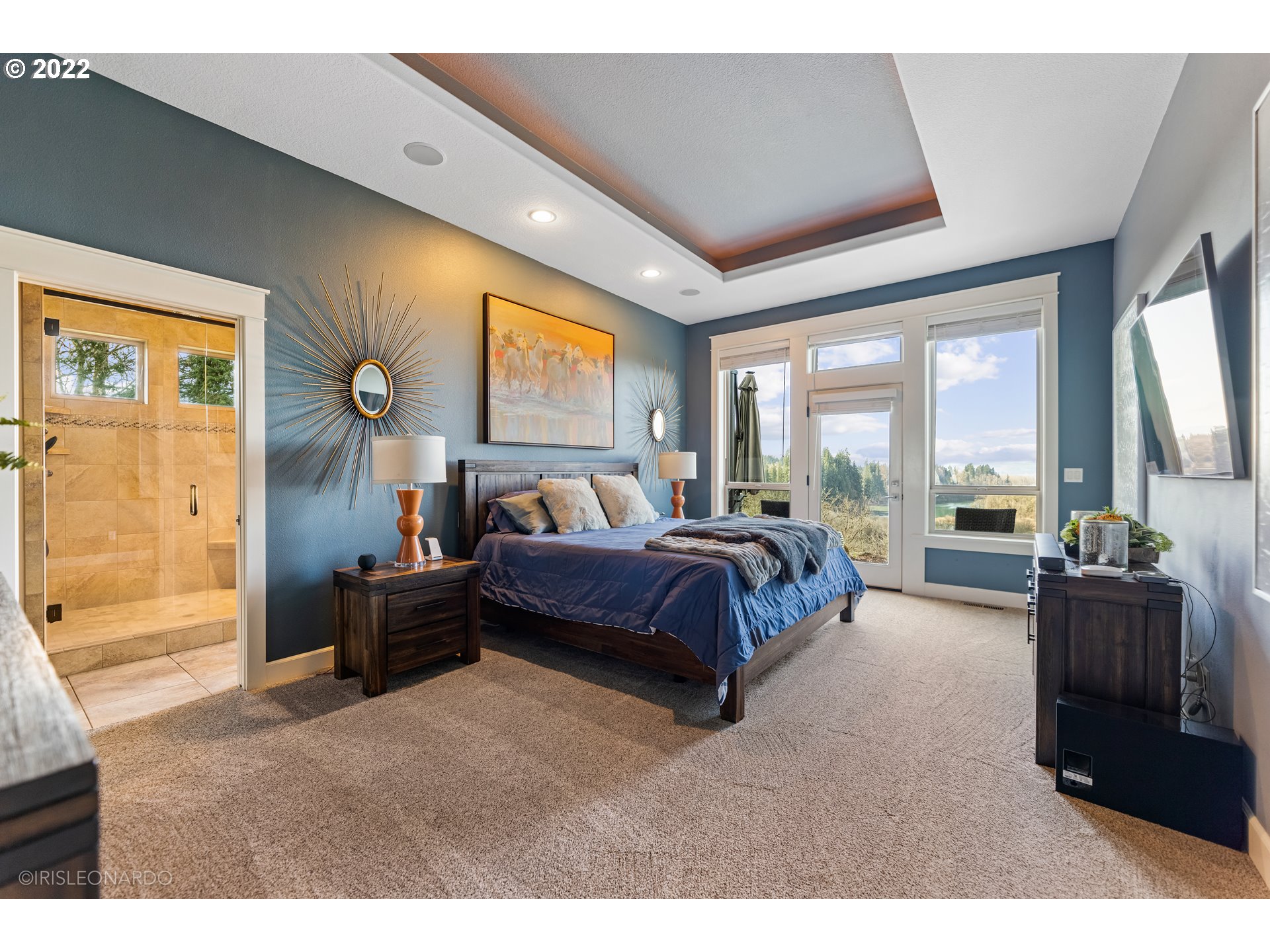 33806 Northwest Norstar Ranch Road Ridgefield, WA 98642 - Photo 15 of 32 a bedroom with a bed and large windows