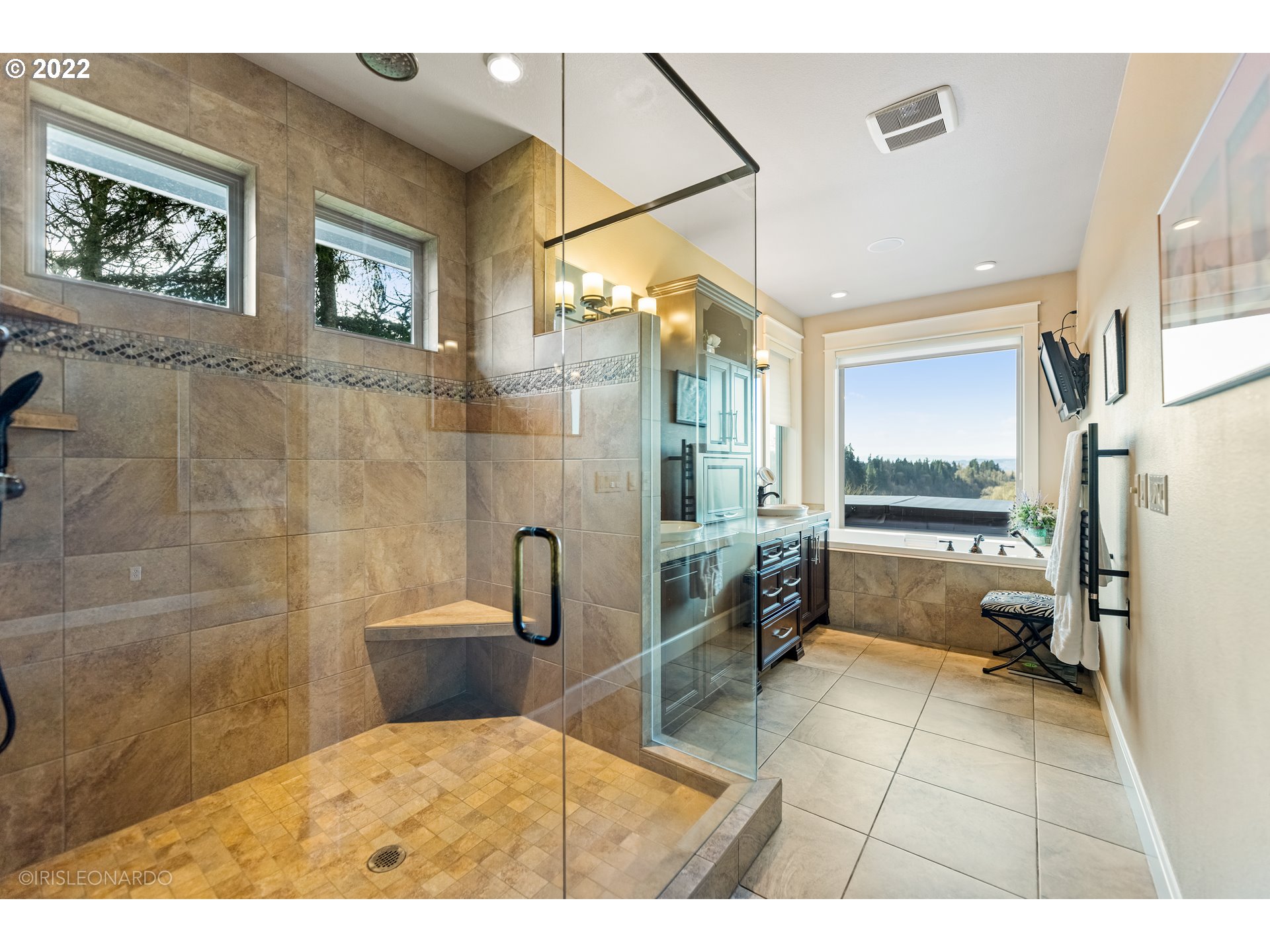 33806 Northwest Norstar Ranch Road Ridgefield, WA 98642 - Photo 17 of 32 a bathroom with a sink a toilet a mirror and a shower