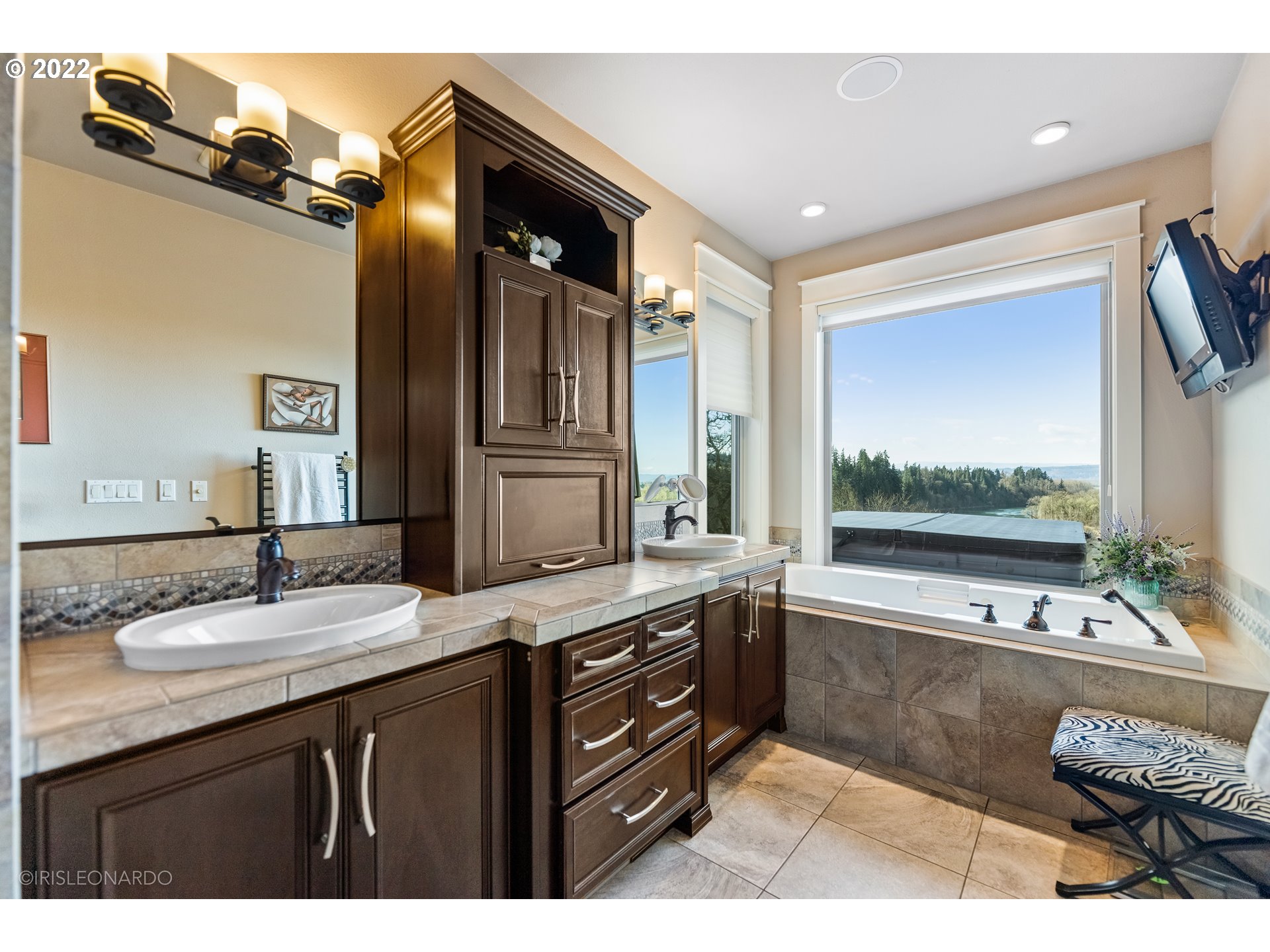 33806 Northwest Norstar Ranch Road Ridgefield, WA 98642 - Photo 18 of 32 a spacious bathroom with a granite countertop tub sink a mirror and shower