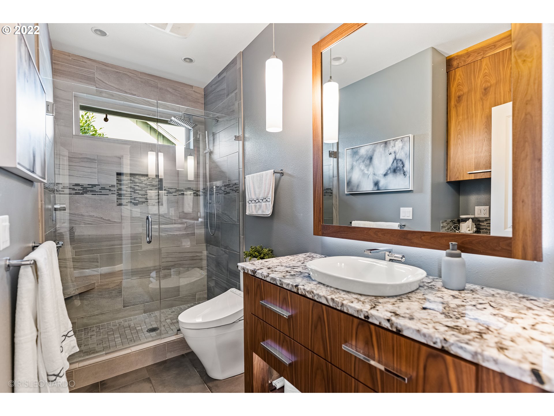 33806 Northwest Norstar Ranch Road Ridgefield, WA 98642 - Photo 24 of 32 a bathroom with a granite countertop sink toilet and shower