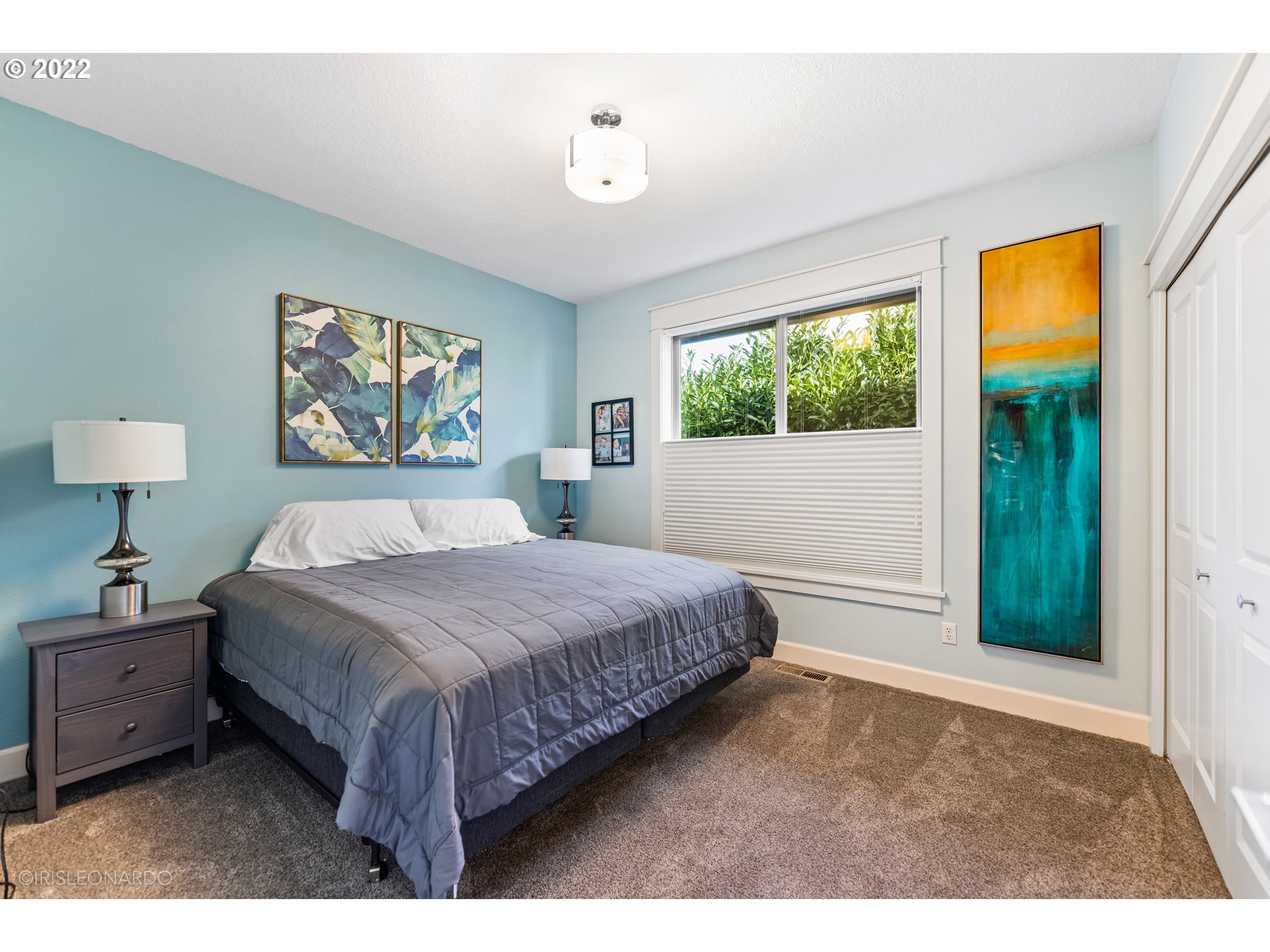 33806 Northwest Norstar Ranch Road Ridgefield, WA 98642 - Photo 25 of 32 a bedroom with a bed and a painting on the wall