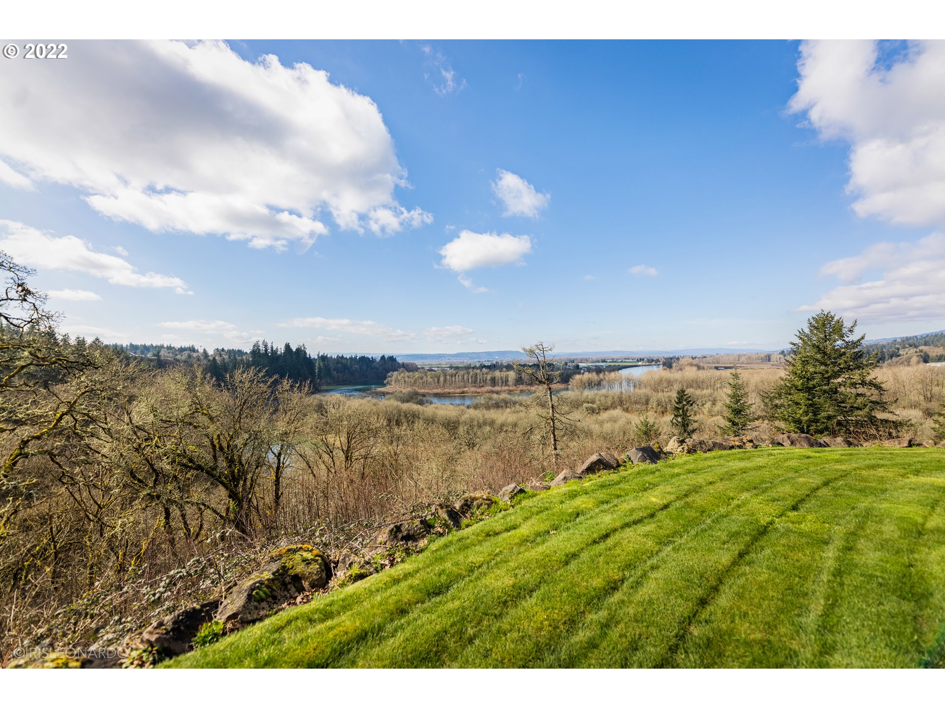 33806 Northwest Norstar Ranch Road Ridgefield, WA 98642 - Photo 4 of 32 a view of a lake with a yard