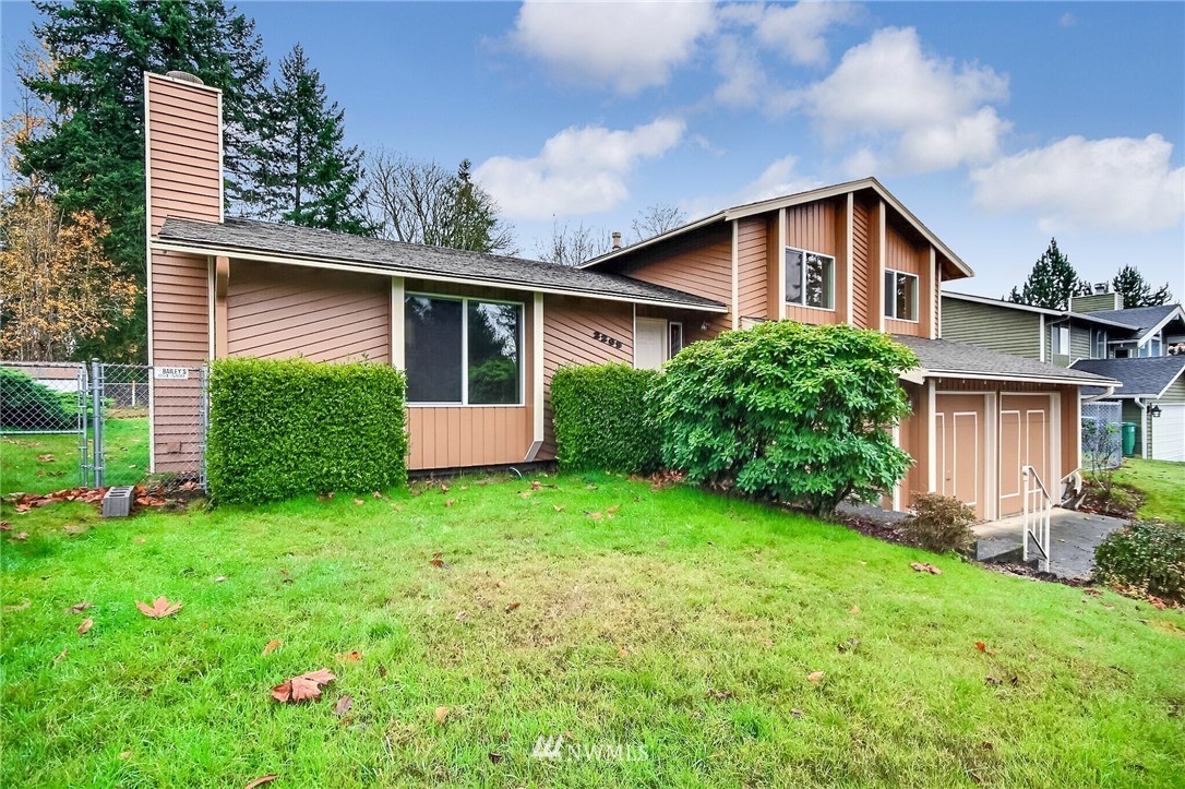 2209 Southeast 21st Street Renton, WA 98055 - Photo 2 of 40 a front view of house with yard and green space