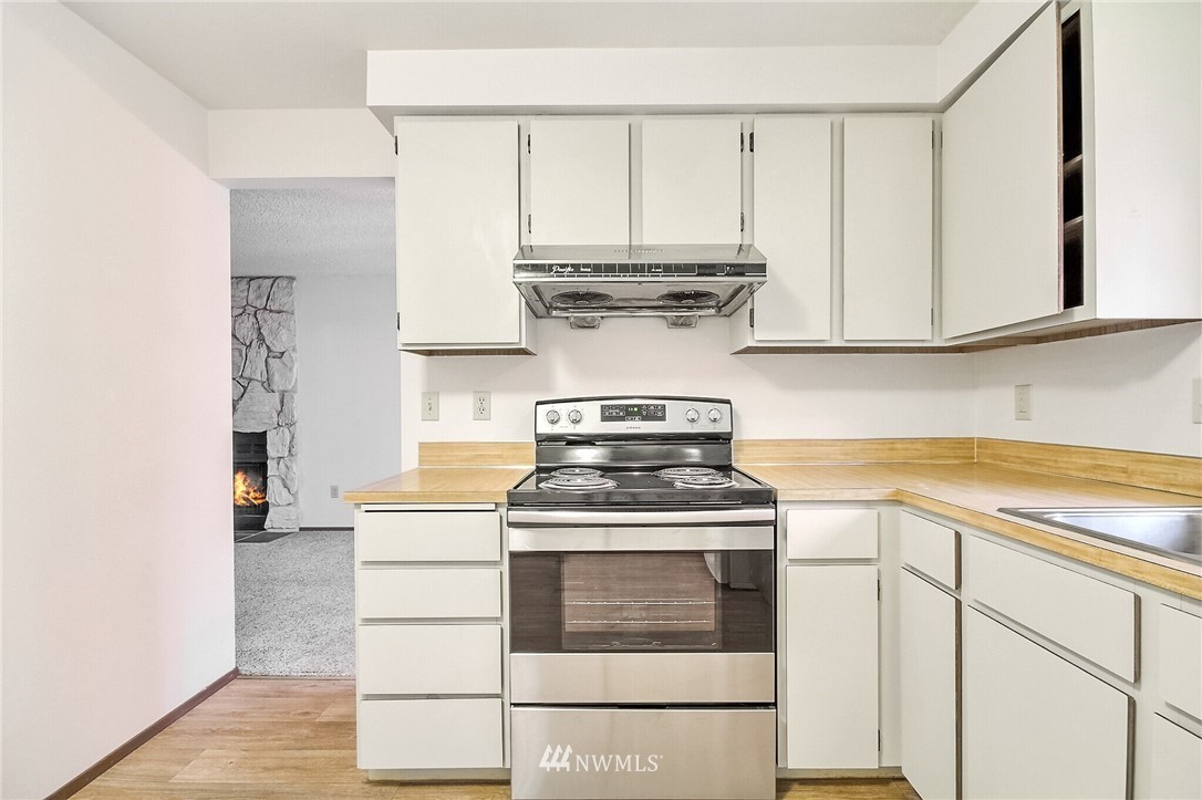 2209 Southeast 21st Street Renton, WA 98055 - Photo 14 of 40 a kitchen with appliances cabinets and a sink
