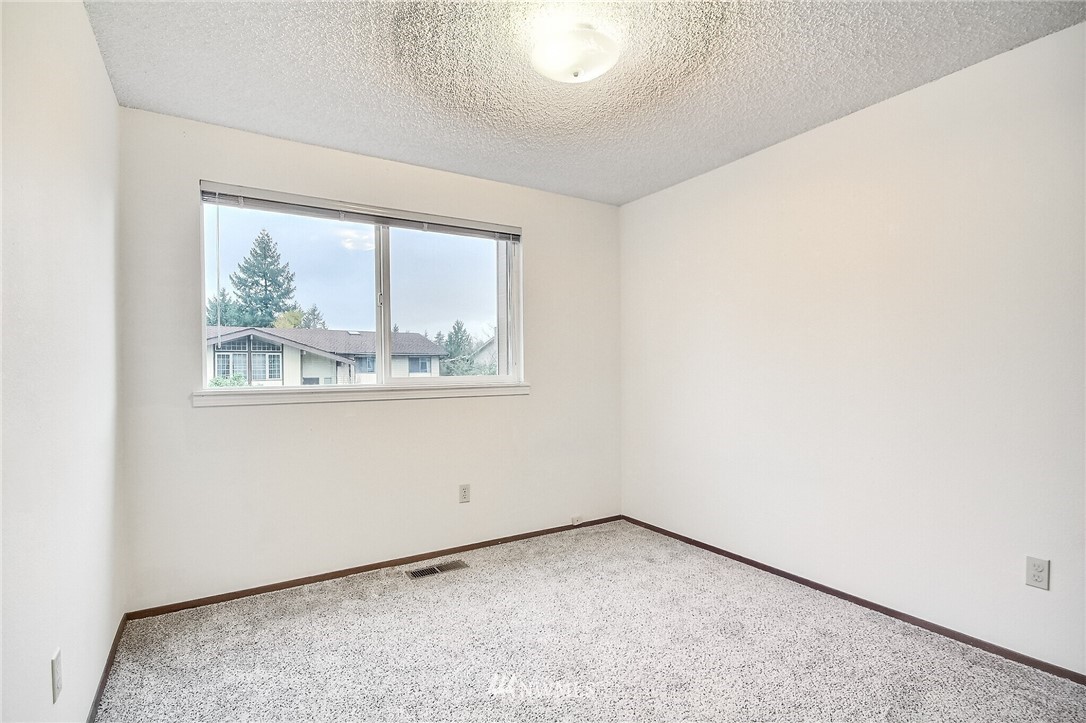 2209 Southeast 21st Street Renton, WA 98055 - Photo 21 of 40 an empty room with a window
