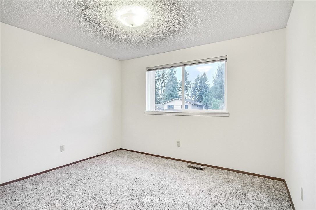 2209 Southeast 21st Street Renton, WA 98055 - Photo 23 of 40 an empty room with a window