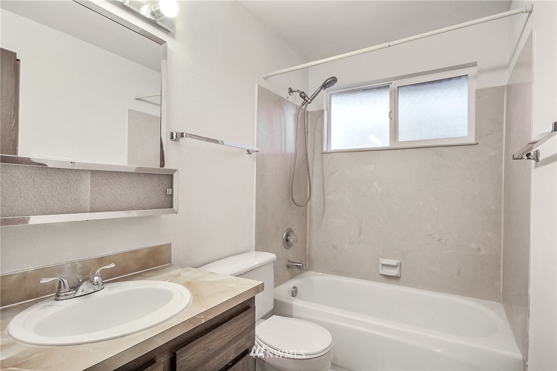 2209 Southeast 21st Street Renton, WA 98055 - Photo 25 of 40 a bathroom with a sink toilet and shower