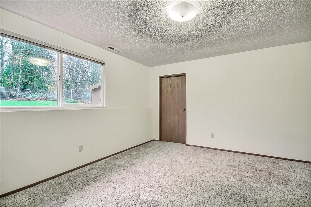 2209 Southeast 21st Street Renton, WA 98055 - Photo 26 of 40 an empty room with a window