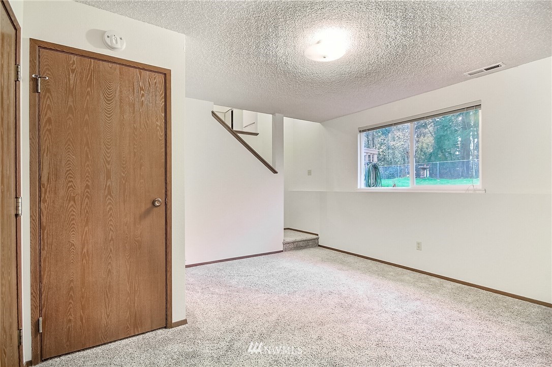 2209 Southeast 21st Street Renton, WA 98055 - Photo 28 of 40 a view of an empty room with a window