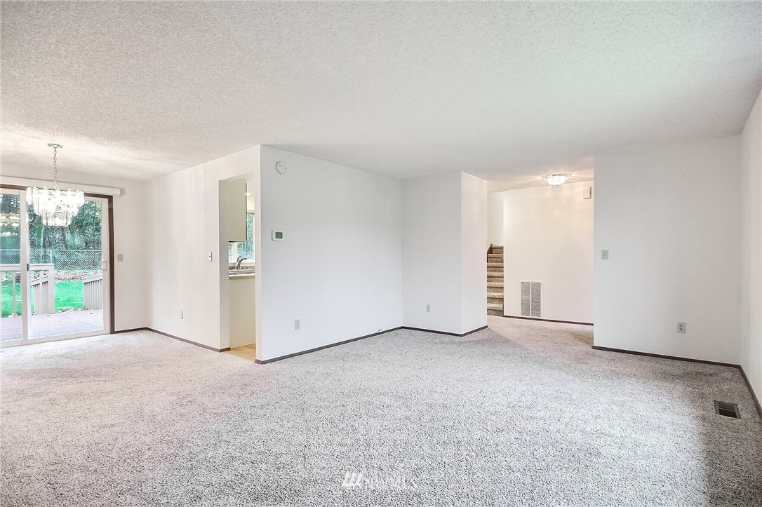 2209 Southeast 21st Street Renton, WA 98055 - Photo 8 of 40 a view of an empty room with a sliding door