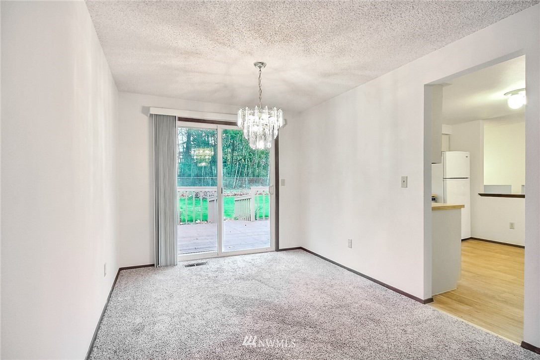 2209 Southeast 21st Street Renton, WA 98055 - Photo 9 of 40 an empty room with windows and outdoor view