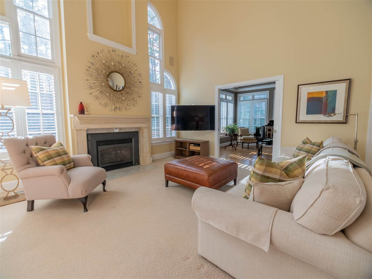 Dramatic 2 story family room with beautiful views to the wooded back yard.