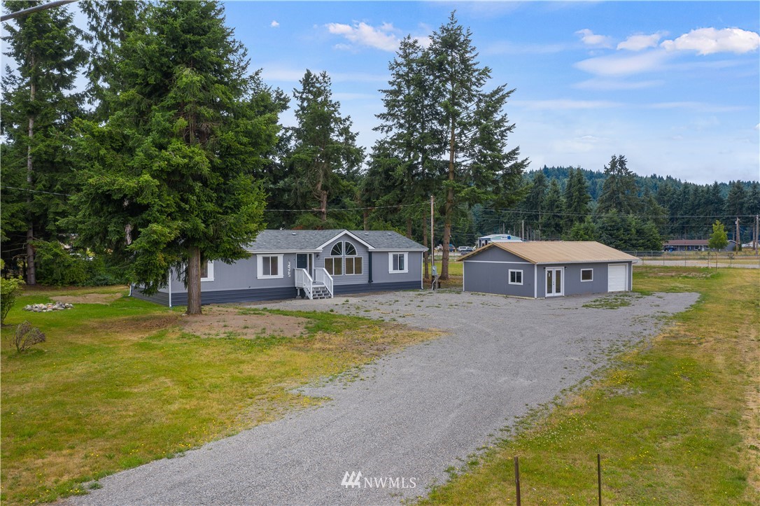 3925 183rd Avenue Southwest Rochester, WA 98579 - Photo 1 of 33 a view of a house with pool and a big yard