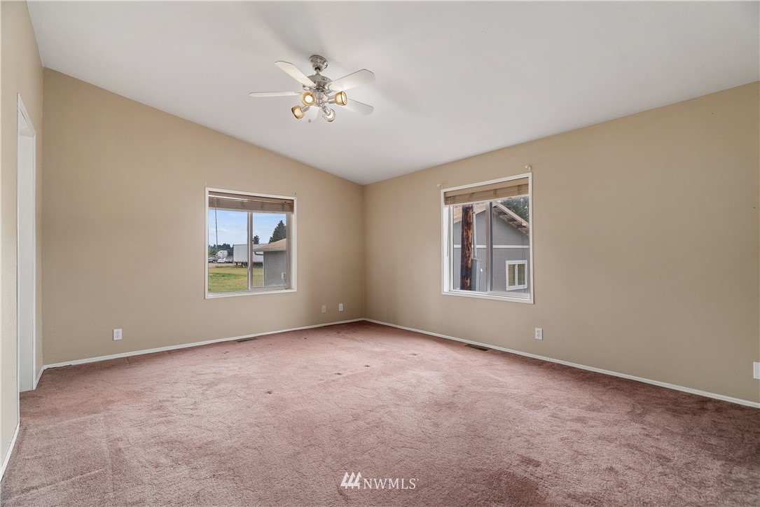 3925 183rd Avenue Southwest Rochester, WA 98579 - Photo 11 of 33 a view of an empty room with a window