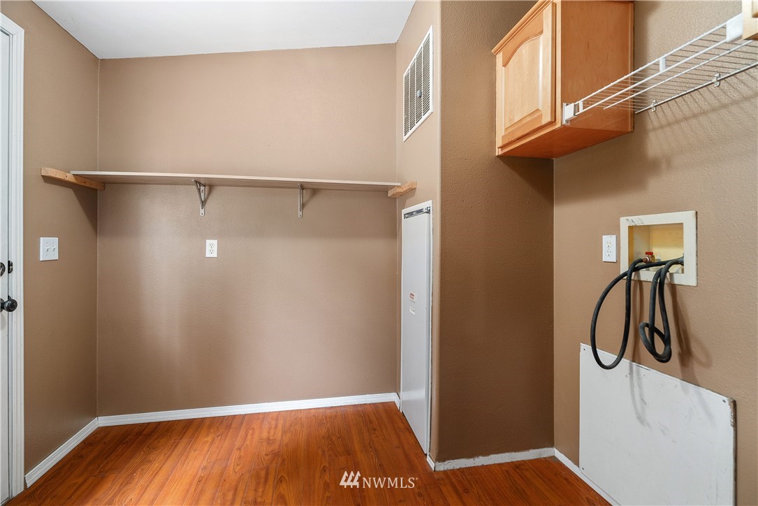 3925 183rd Avenue Southwest Rochester, WA 98579 - Photo 14 of 33 a view of a room with rack on the wall