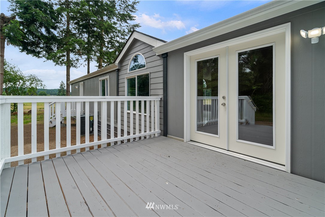 3925 183rd Avenue Southwest Rochester, WA 98579 - Photo 16 of 33 a view of a house with wooden deck