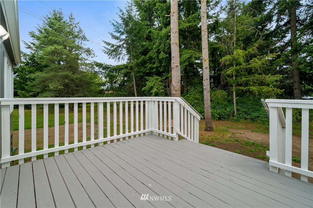 3925 183rd Avenue Southwest Rochester, WA 98579 - Photo 17 of 33 a balcony with view of trees in front of it