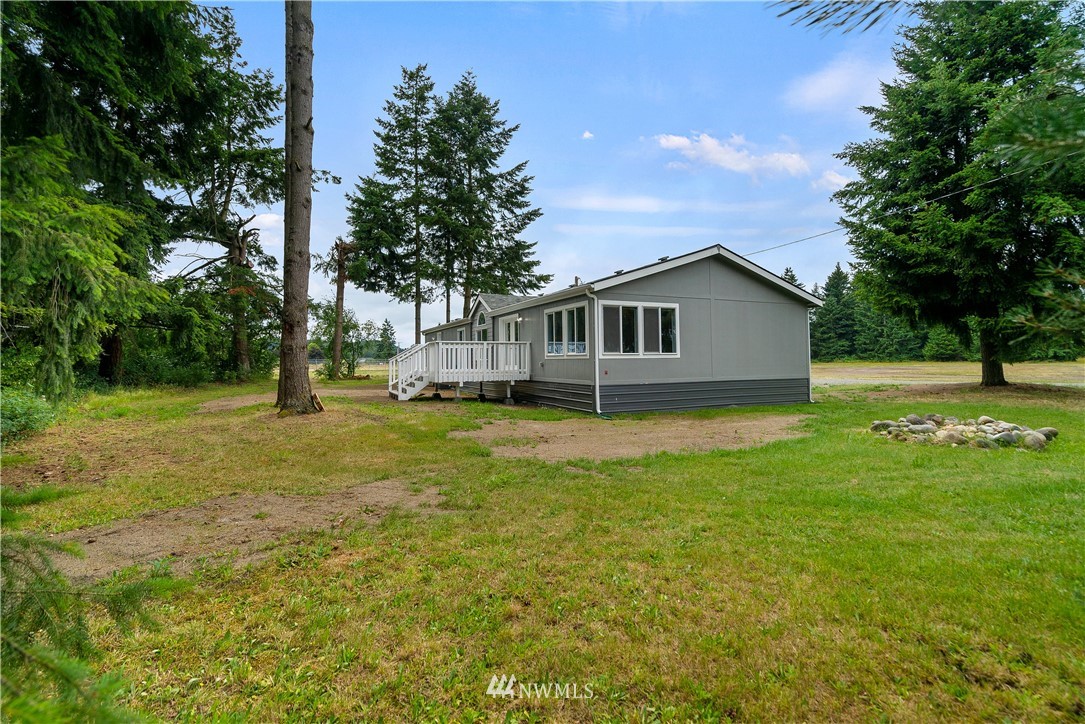 3925 183rd Avenue Southwest Rochester, WA 98579 - Photo 22 of 33 a view of a house with a yard