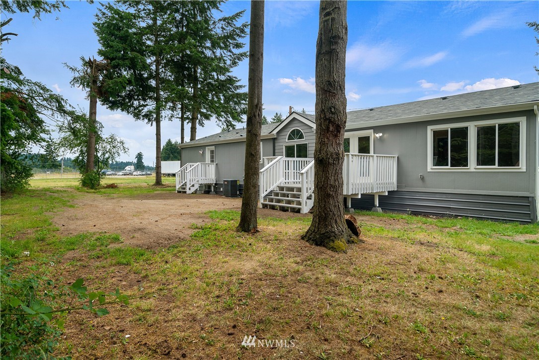 3925 183rd Avenue Southwest Rochester, WA 98579 - Photo 23 of 33 a view of a house with backyard and a tree