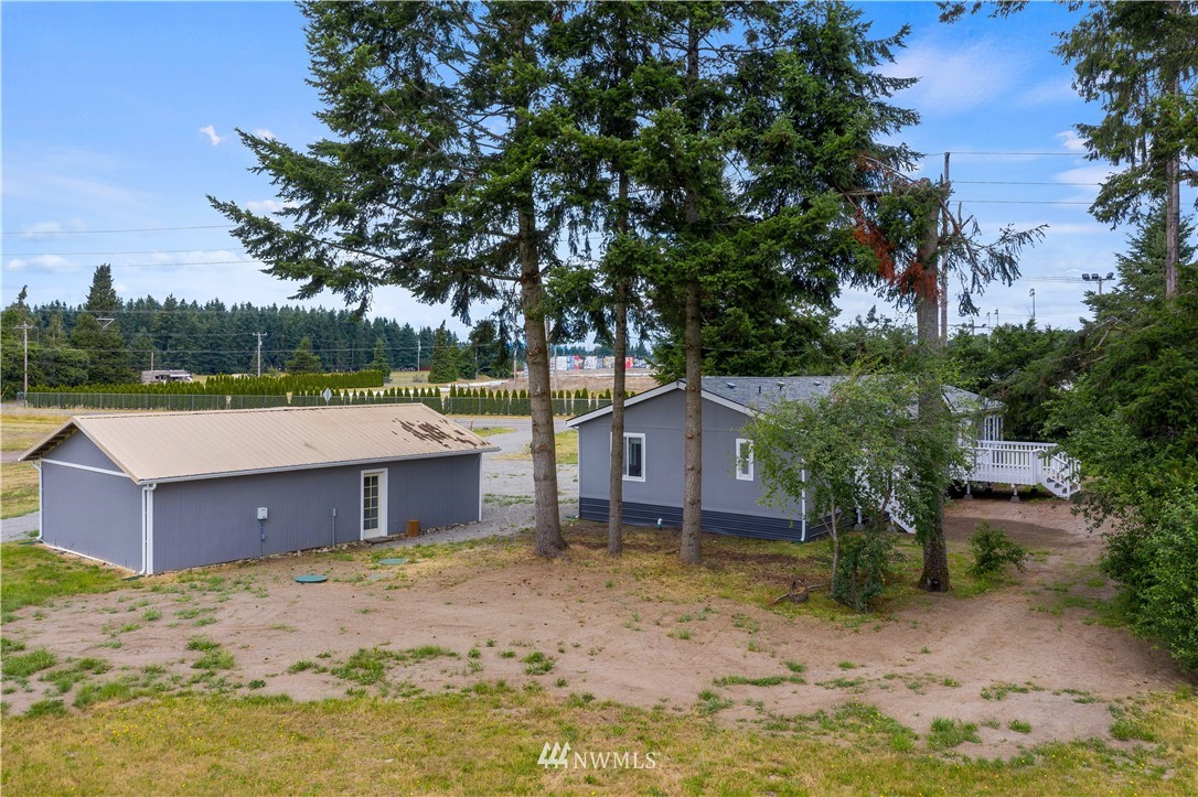 3925 183rd Avenue Southwest Rochester, WA 98579 - Photo 29 of 33 a view of a house with a yard and large tree