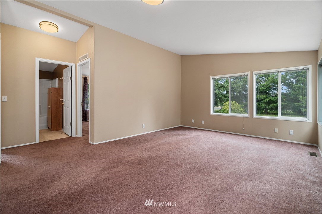 3925 183rd Avenue Southwest Rochester, WA 98579 - Photo 8 of 33 an empty room with windows and closet