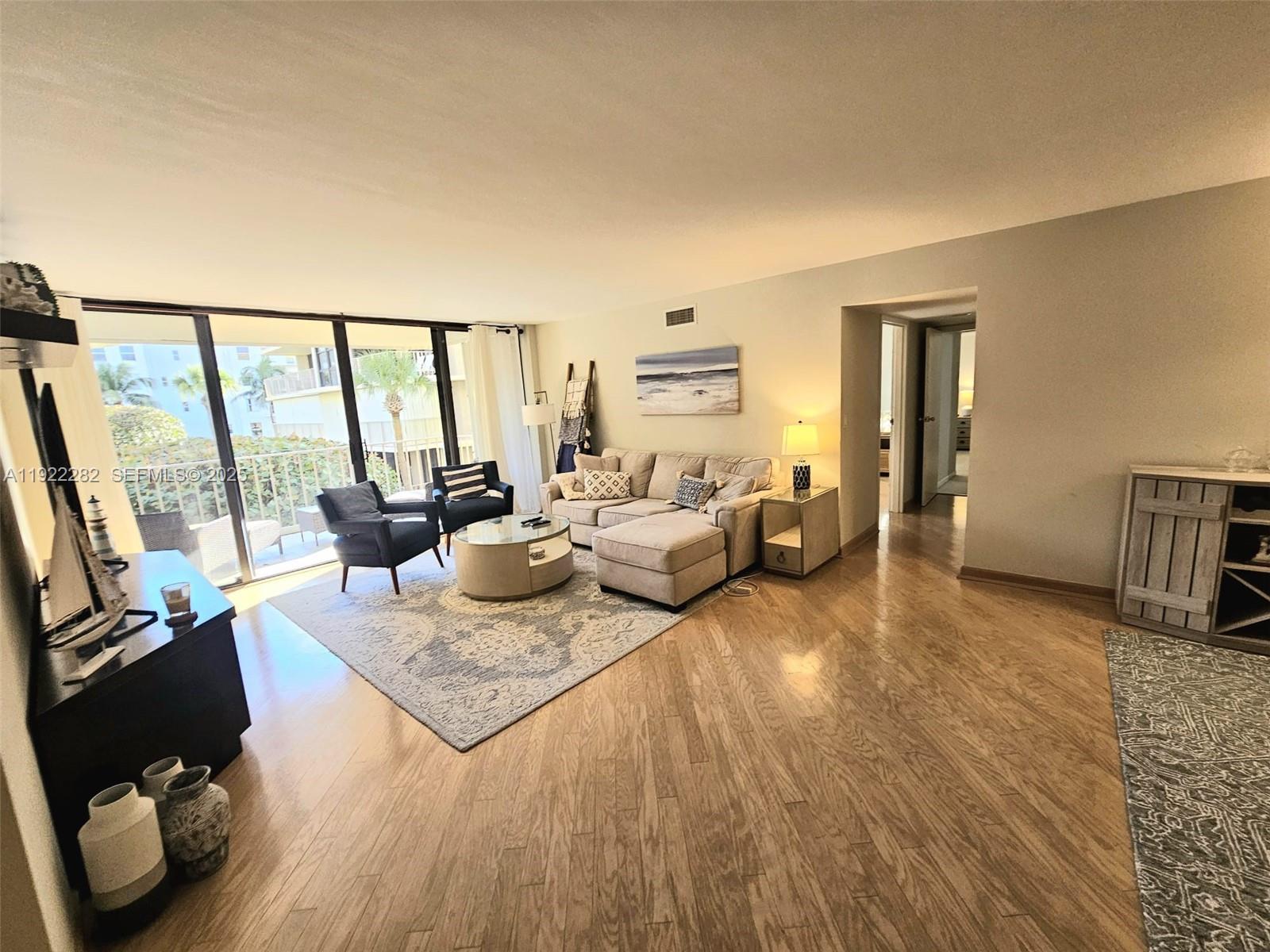 3200 South Ocean Boulevard, Unit D203 Palm Beach, FL 33480 - Photo 1 of 6 a living room with furniture window and a table