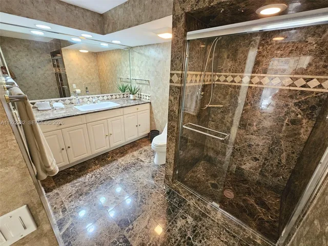 a view of a patio with couches table and chairs and potted plants