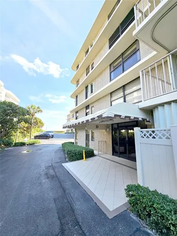 a bedroom with a bed and a flat tv screen