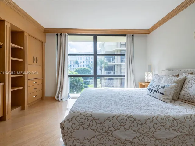 a view of a dining room with furniture and a window