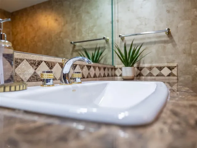 a balcony with furniture and a potted plant