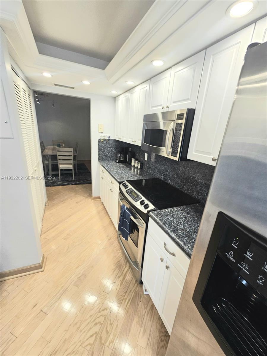 3200 South Ocean Boulevard, Unit D203 Palm Beach, FL 33480 - Photo 5 of 6 a kitchen with granite countertop a stove and a sink