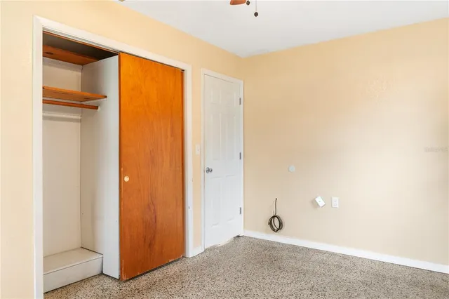 a view of house and yard with swimming pool