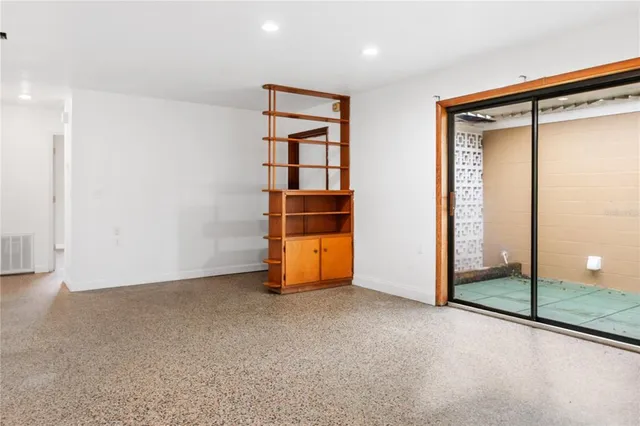 a view of an empty room with a window