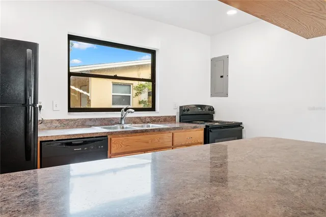 a view of a pathway both side of the house