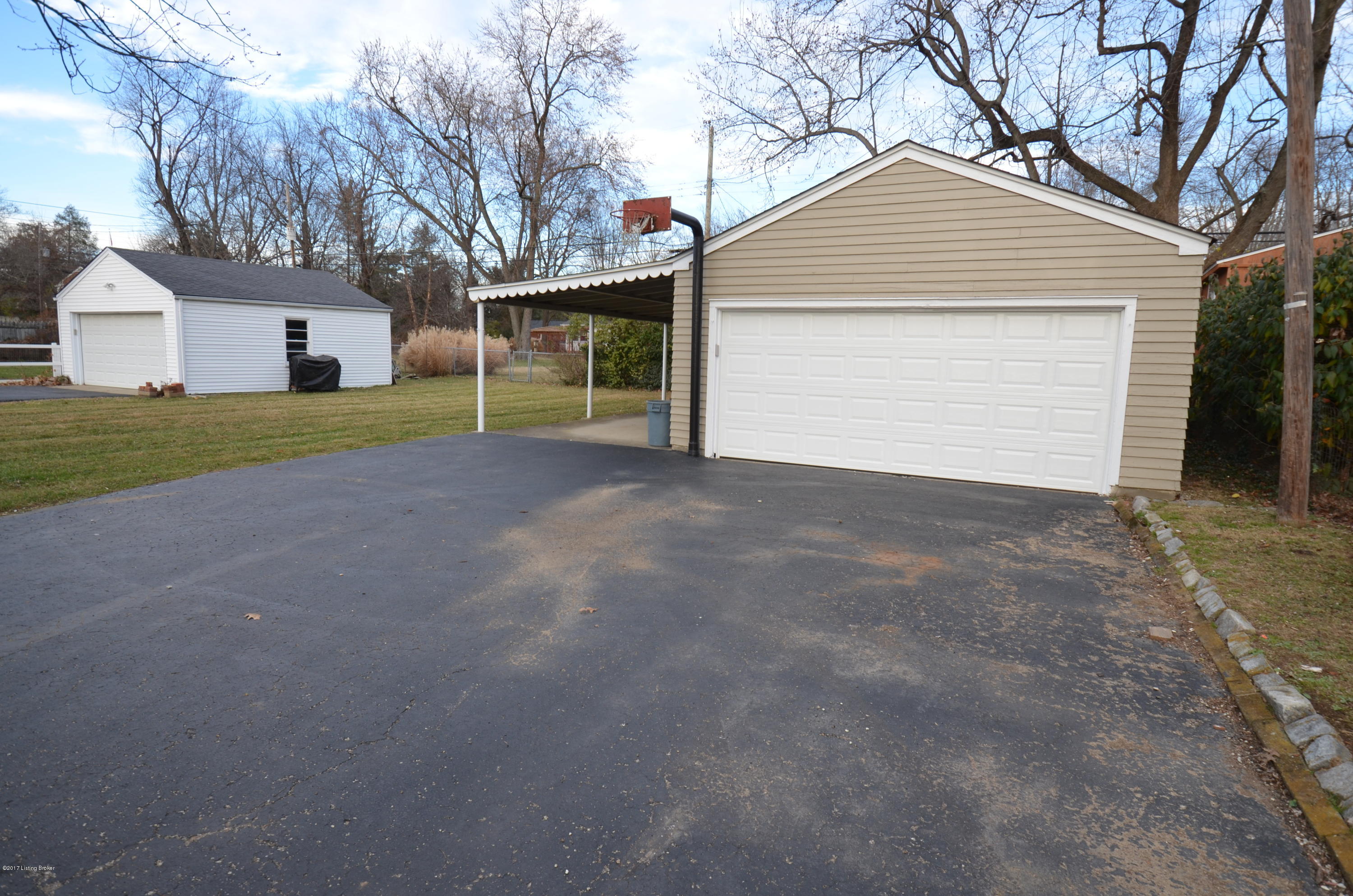 719 Indian Ridge Road Louisville, KY 40207 - Photo 8 of 38 2 car garage with carport