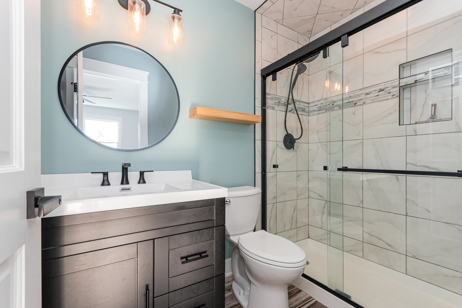 22 Sherwick Road Oswego, IL 60543 - Photo 16 of 29 a bathroom with a sink a toilet and a mirror