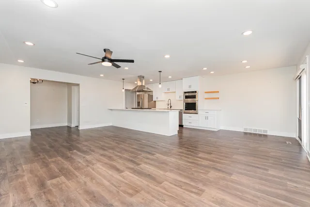 a view of a kitchen with a sink and a stove