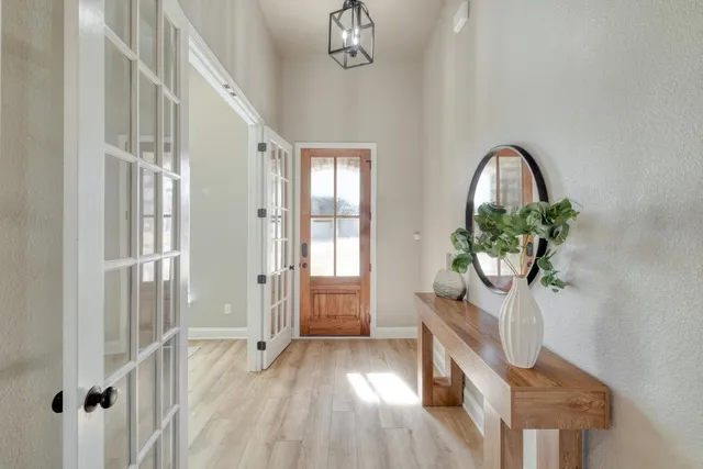 a view of entryway with wooden floor