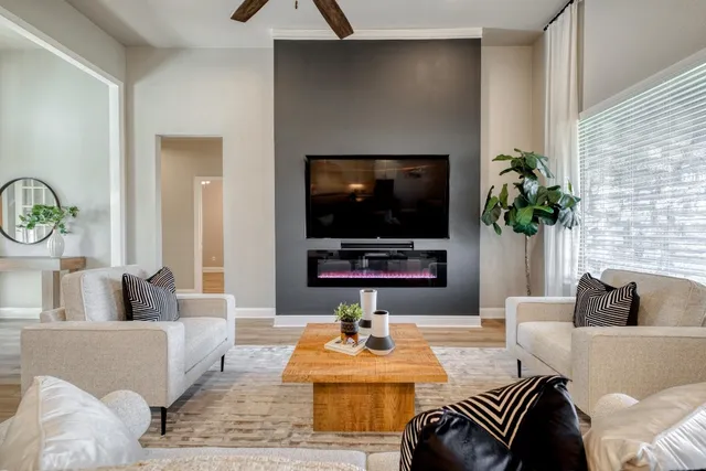 a living room with furniture and a flat screen tv
