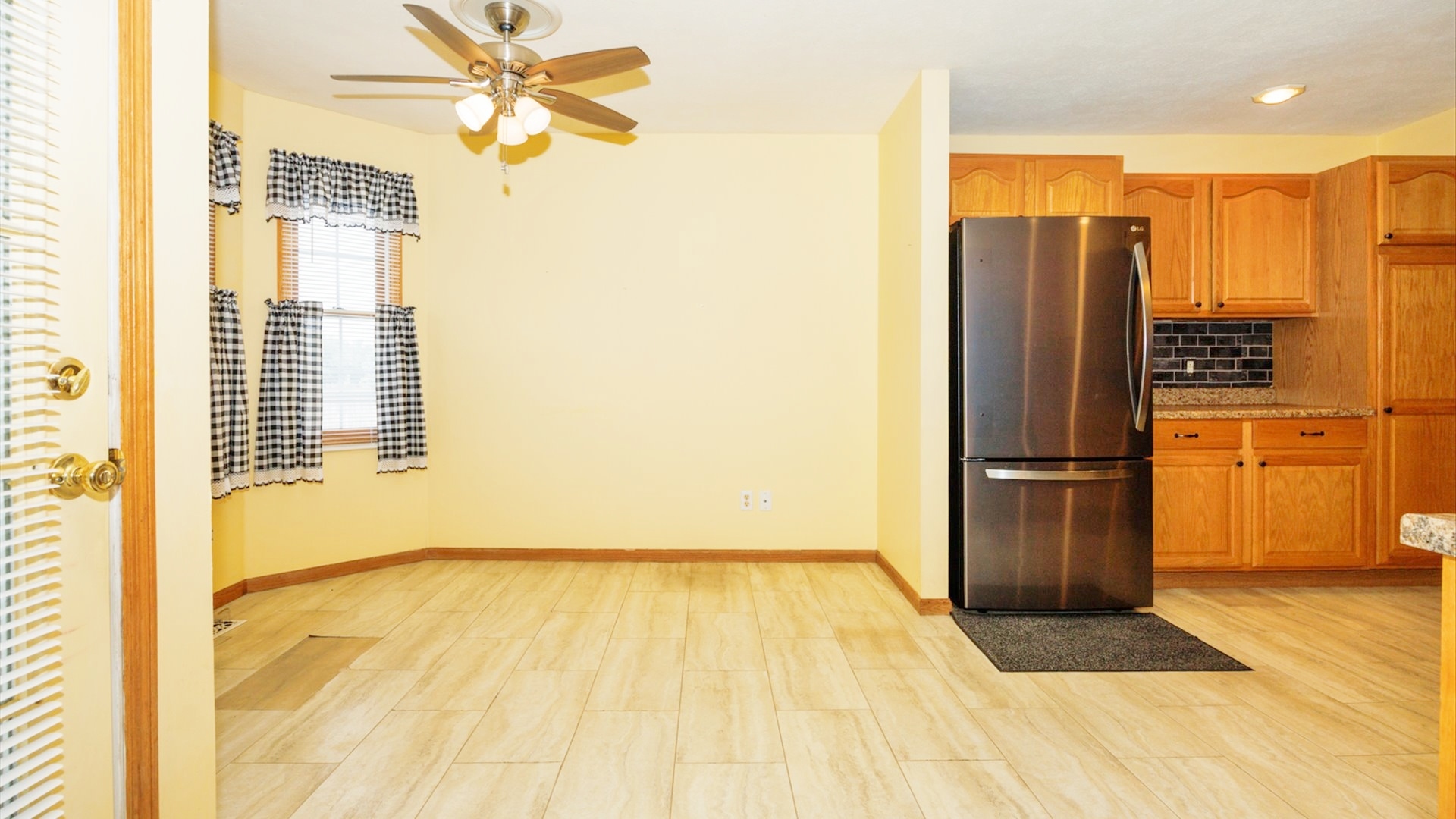411 Wildberry Drive Normal, IL 61761 - Photo 14 of 51 a view of a kitchen with a fridge and a sink