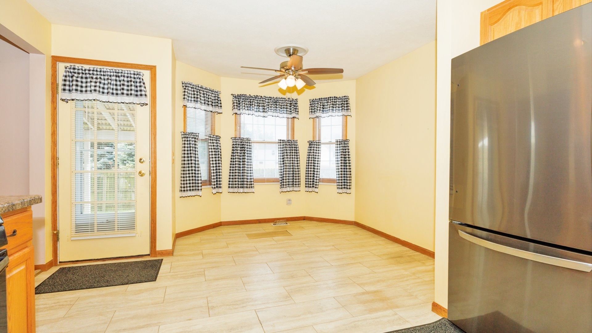 411 Wildberry Drive Normal, IL 61761 - Photo 16 of 51 a view of an empty room with a window