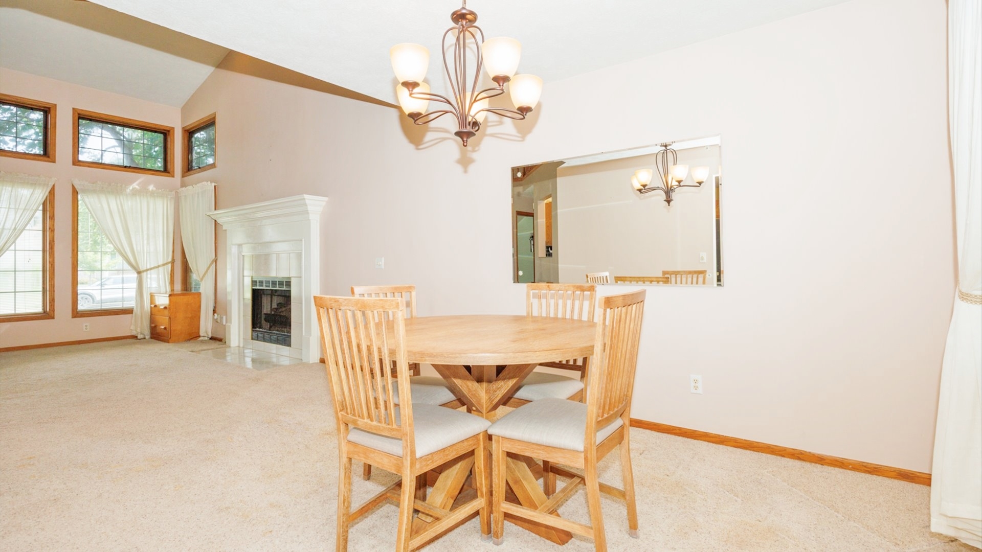 411 Wildberry Drive Normal, IL 61761 - Photo 18 of 51 a view of a dining room with furniture and a chandelier