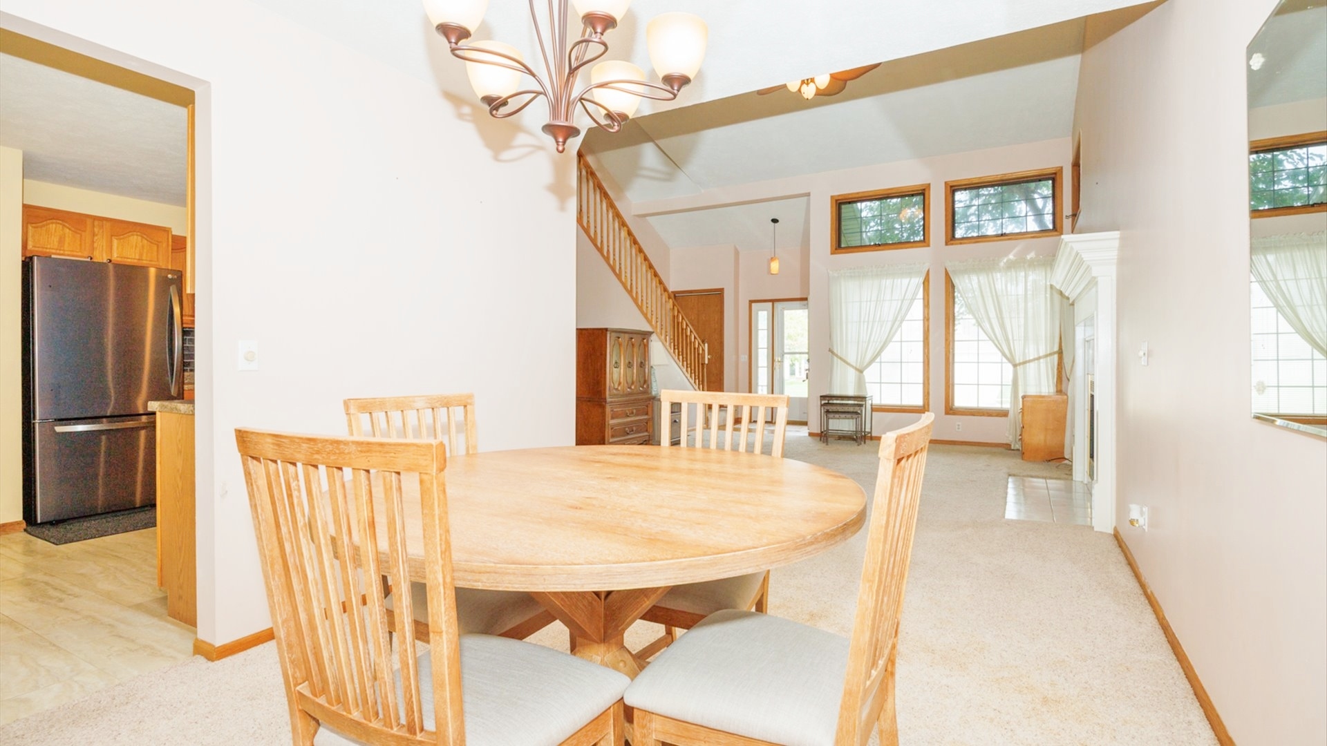 411 Wildberry Drive Normal, IL 61761 - Photo 19 of 51 a view of a living room with a table and chairs