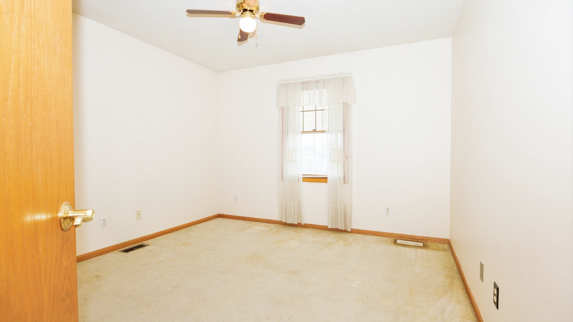 411 Wildberry Drive Normal, IL 61761 - Photo 28 of 51 a view of a room with a ceiling fan
