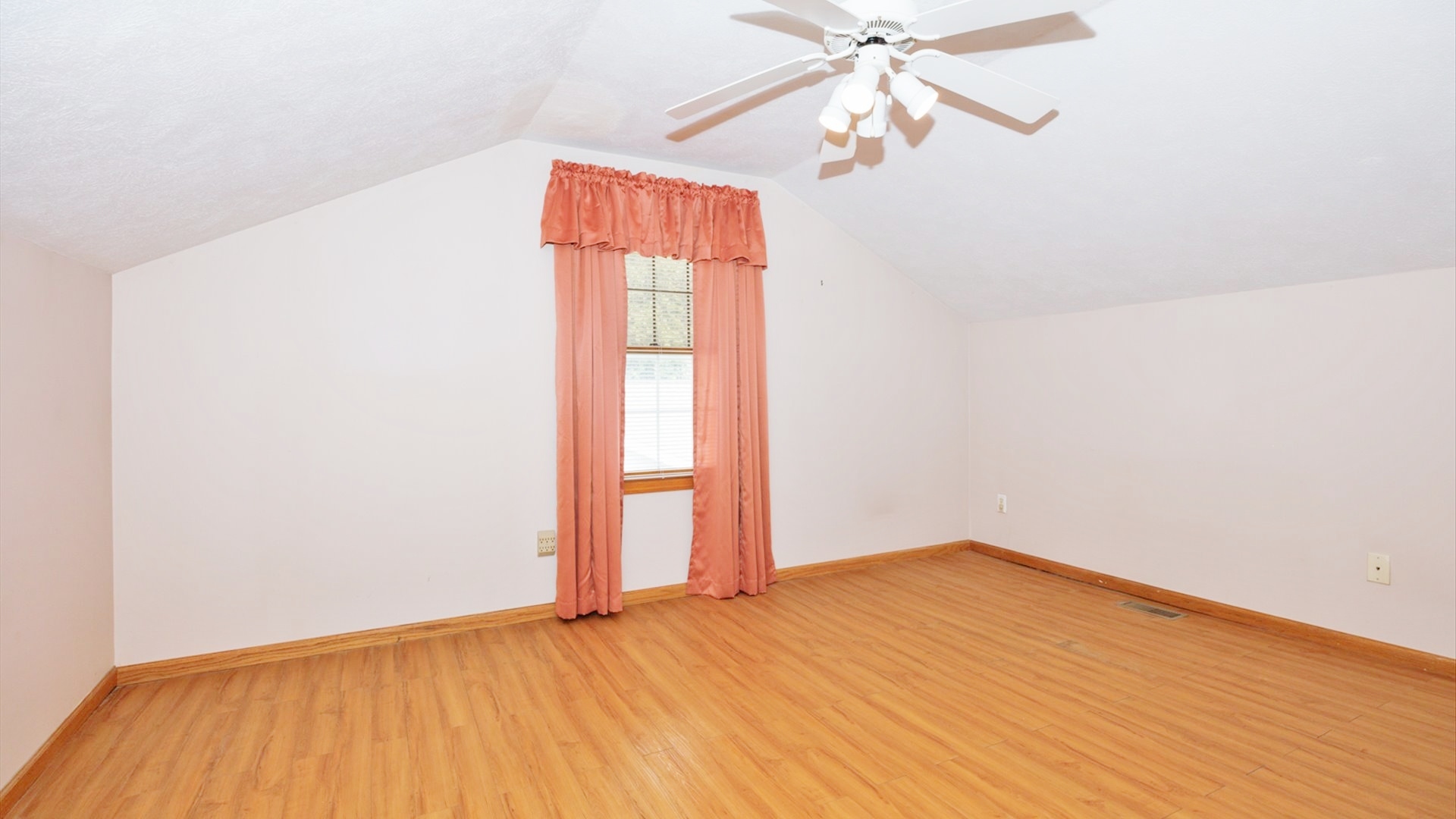 411 Wildberry Drive Normal, IL 61761 - Photo 32 of 51 an empty room with a window and wooden floor