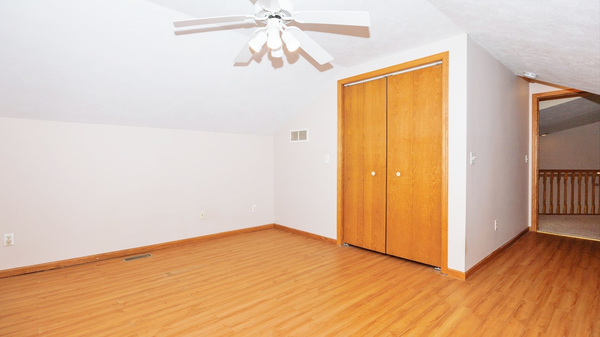 411 Wildberry Drive Normal, IL 61761 - Photo 33 of 51 a view of empty room with wooden floor and fan