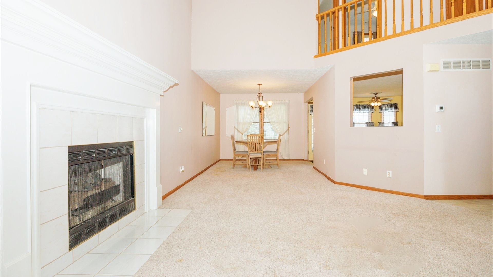411 Wildberry Drive Normal, IL 61761 - Photo 5 of 51 a view of a hallway with wooden floor and a living room