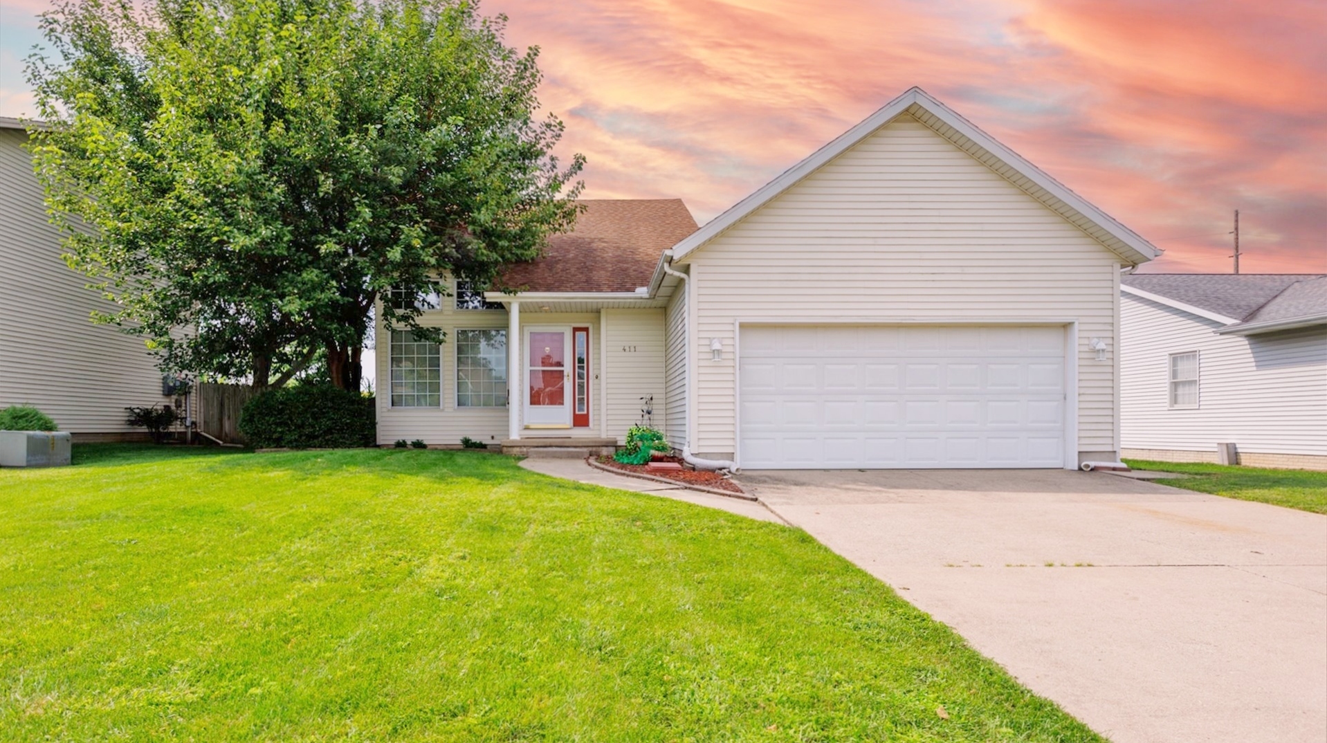 411 Wildberry Drive Normal, IL 61761 - Photo 51 of 51 a view of a house with a yard and garage