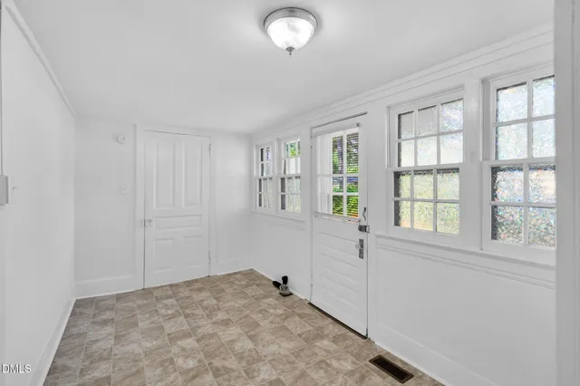 an empty room with windows