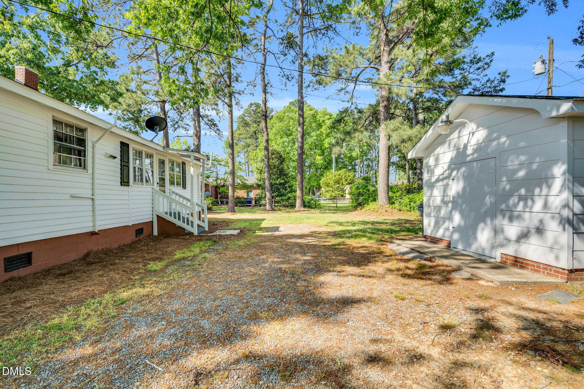 310 Chicopee Road Benson, NC 27504 - Photo 16 of 23 a view of a house with backyard and tree